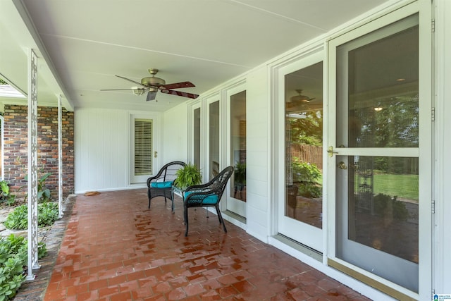 exterior space with a porch and ceiling fan