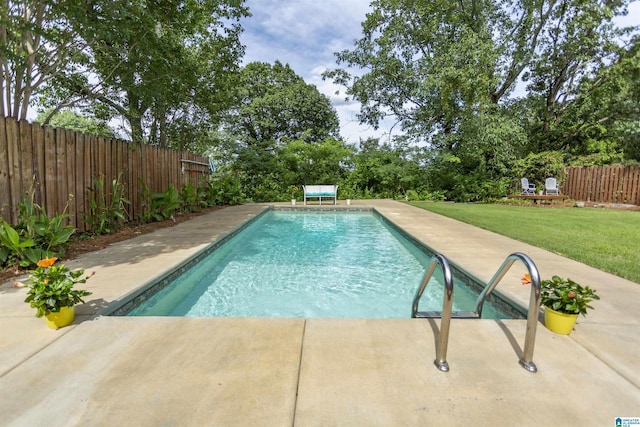 view of swimming pool with a yard, a patio area, a fenced backyard, and a fenced in pool