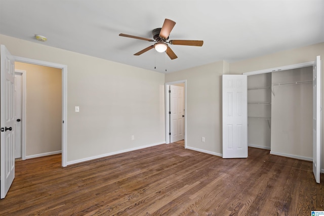 unfurnished bedroom with dark hardwood / wood-style flooring, a closet, and ceiling fan