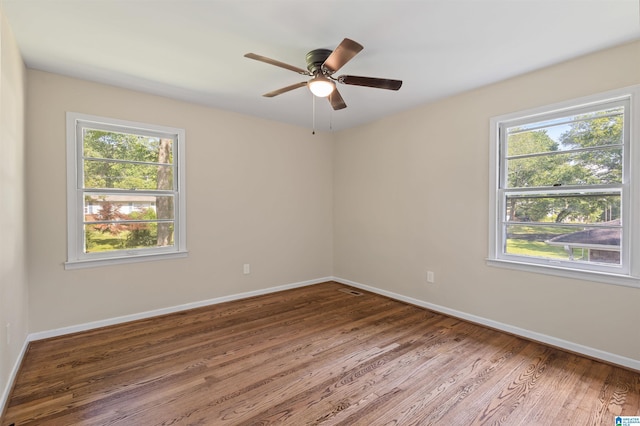 spare room featuring hardwood / wood-style flooring and ceiling fan