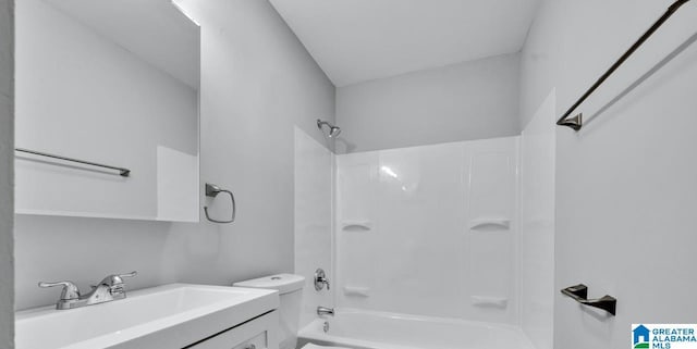 full bathroom with vanity, toilet, and washtub / shower combination