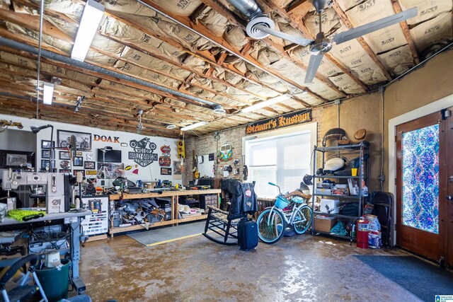 4919 Railroad Ave, Adamsville, AL 35005 - garage with a workshop area and a ceiling fan