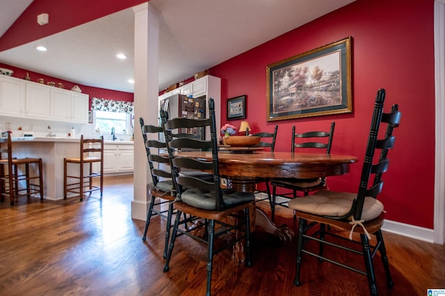 dining area featuring sink and hardwood / wood-style floors