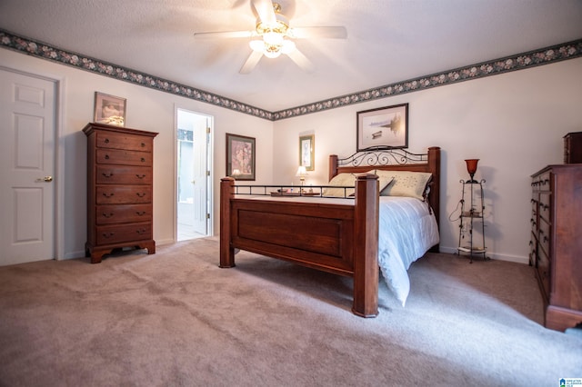 bedroom featuring ceiling fan, a textured ceiling, and carpet flooring