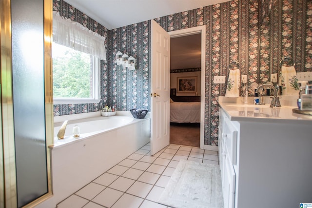 bathroom featuring a bath to relax in, tile flooring, and oversized vanity