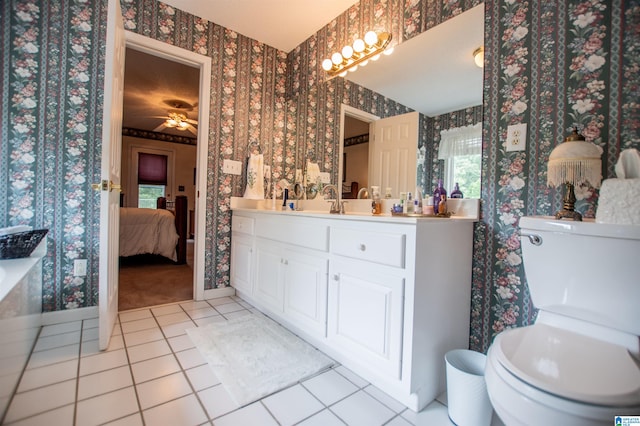 bathroom featuring ceiling fan, vanity, toilet, and tile floors