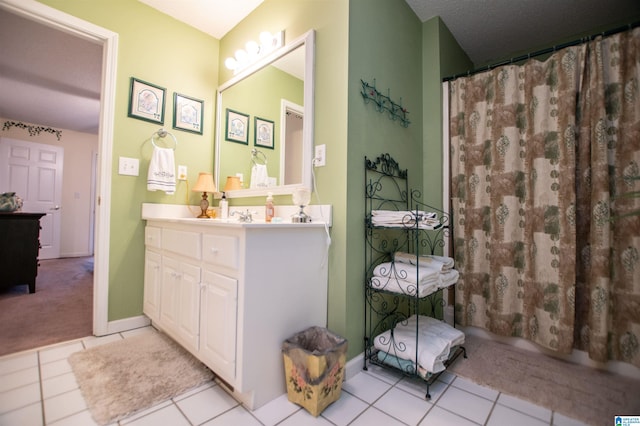 bathroom featuring tile flooring and large vanity