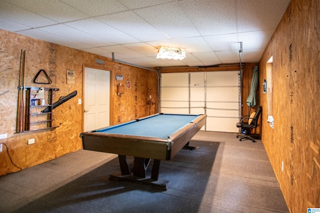 rec room featuring wood walls, pool table, and a drop ceiling