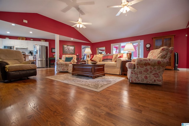 living room featuring ceiling fan, vaulted ceiling, and hardwood / wood-style flooring