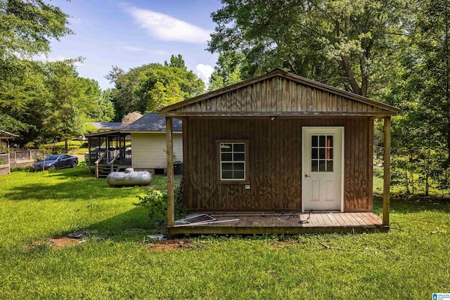 view of outbuilding featuring a yard