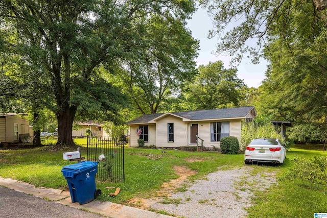 ranch-style home with a front yard