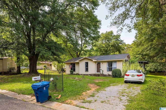 single story home with a front yard