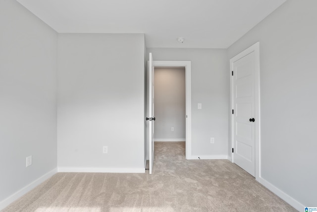 unfurnished bedroom with light carpet