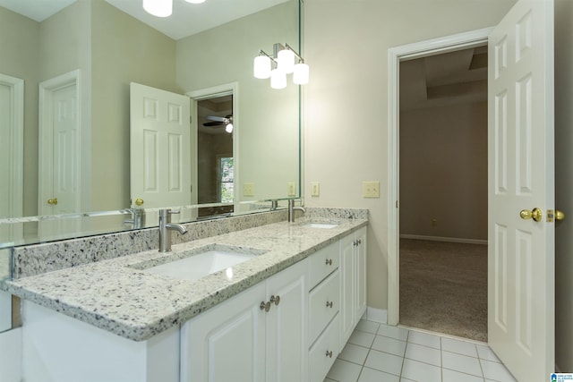 bathroom featuring tile patterned floors, ceiling fan, and vanity