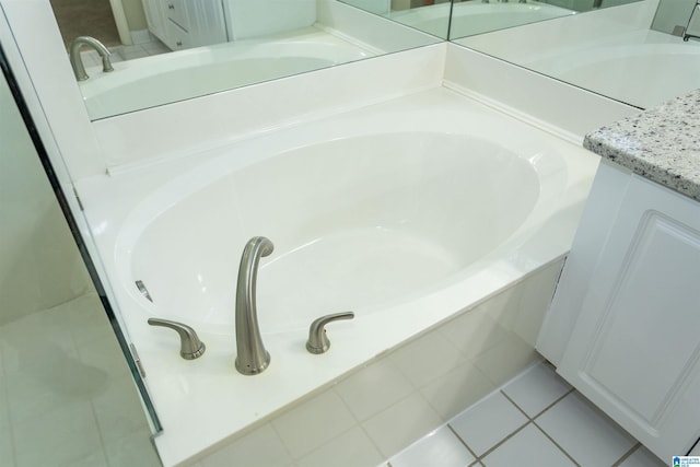 details with vanity and a tub