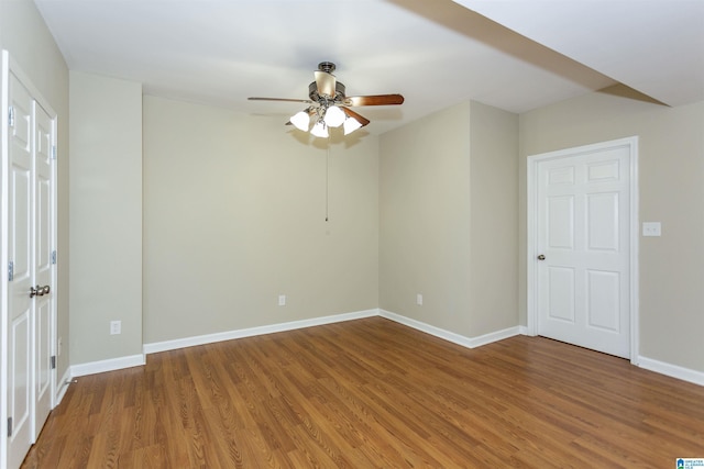 unfurnished room featuring hardwood / wood-style flooring and ceiling fan