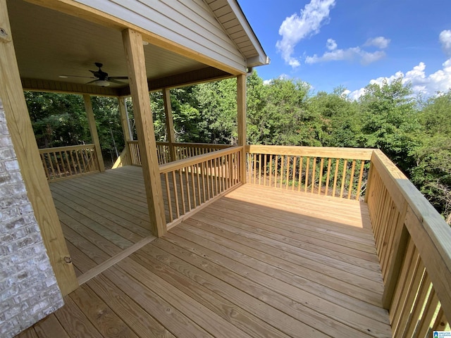 wooden terrace featuring ceiling fan