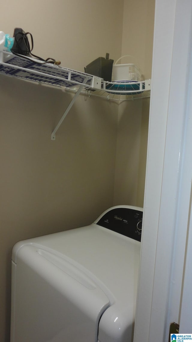 laundry room with washer / dryer