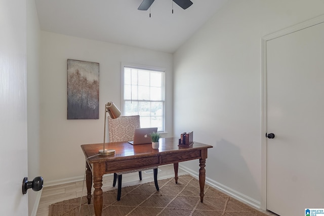 office space featuring ceiling fan, wood-type flooring, and vaulted ceiling