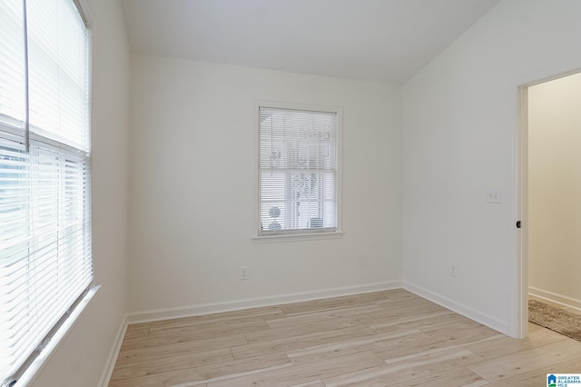 empty room with light hardwood / wood-style floors