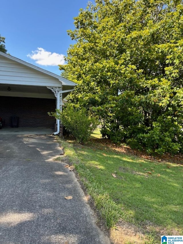 view of side of property with a carport