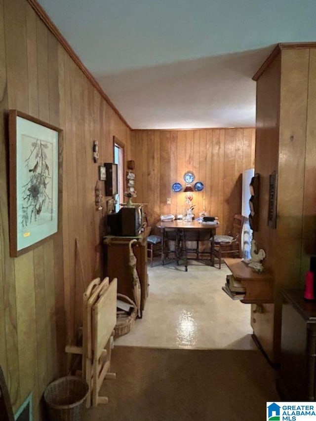 hallway with wooden walls and crown molding