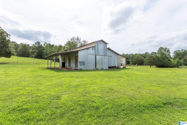 873 Buckelew Rd, Anniston, AL 36207 - view of grassy yard featuring an outbuilding