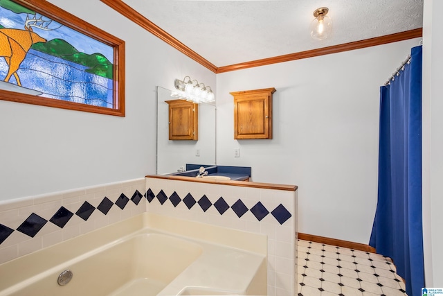 bathroom with a bathing tub, vanity, and ornamental molding