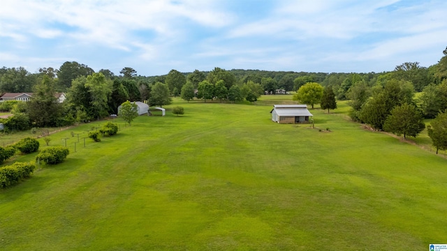 birds eye view of property featuring a rural view