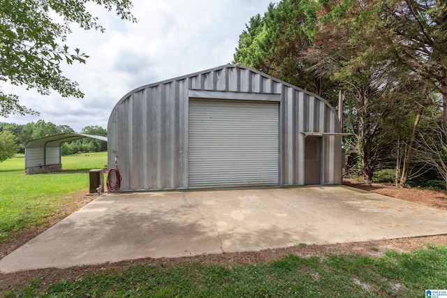 873 Buckelew Rd, Anniston, AL 36207 - detached garage featuring concrete driveway