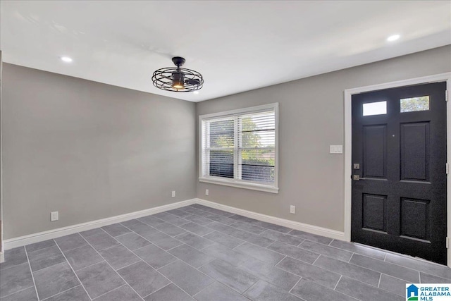 foyer featuring ceiling fan