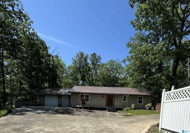 single story home featuring a garage