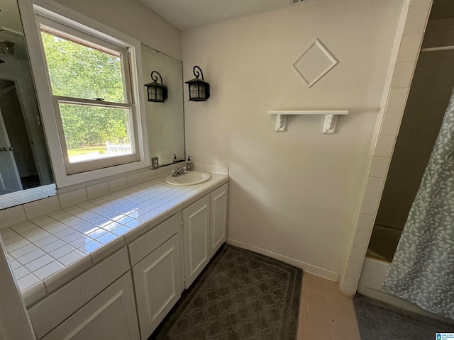 bathroom featuring vanity and shower / bath combo with shower curtain