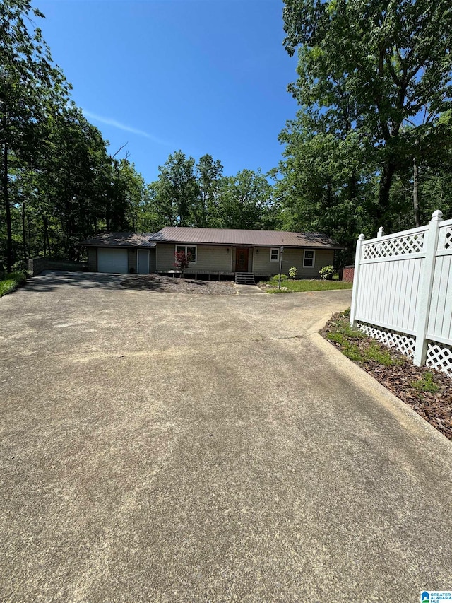 single story home with a garage