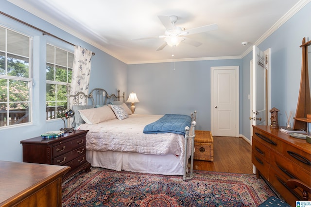 bedroom featuring ceiling fan, wood-type flooring, and ornamental molding