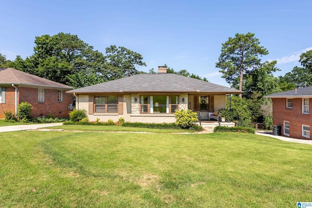 ranch-style home with a front lawn