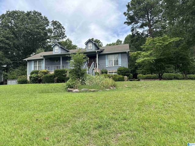 view of front of home featuring a porch and a front yard