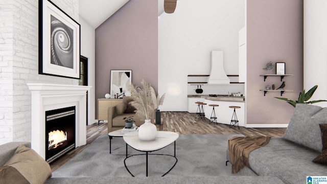 living room featuring vaulted ceiling and hardwood / wood-style flooring