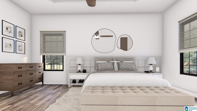 bedroom with ceiling fan and wood-type flooring