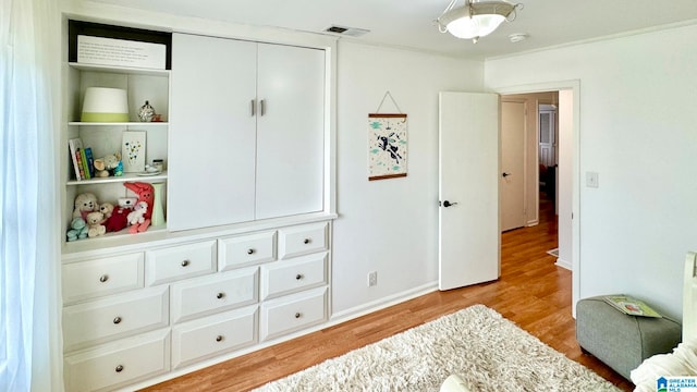 bedroom featuring a closet and light hardwood / wood-style flooring