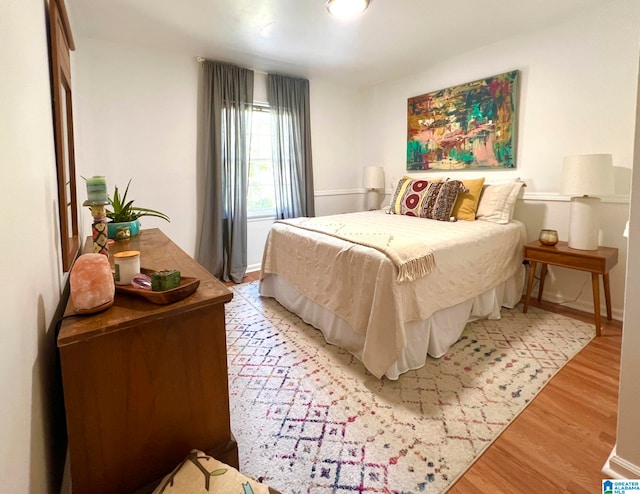 bedroom with light hardwood / wood-style flooring