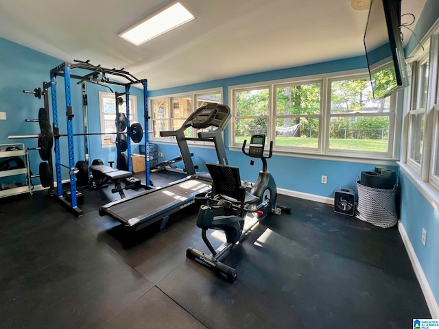 workout room featuring vaulted ceiling