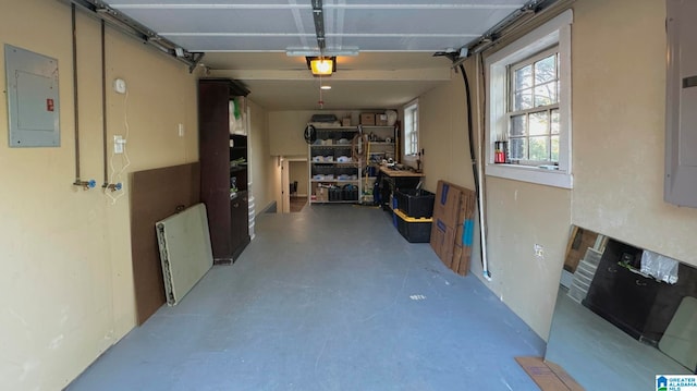 garage featuring electric panel and a garage door opener