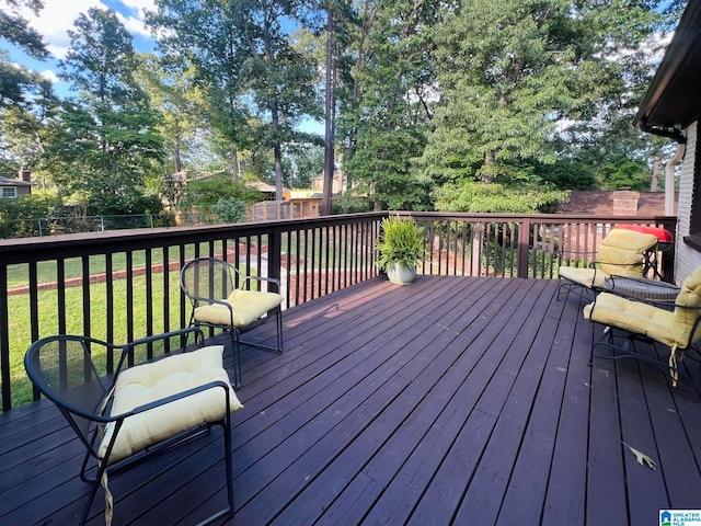 deck featuring a lawn