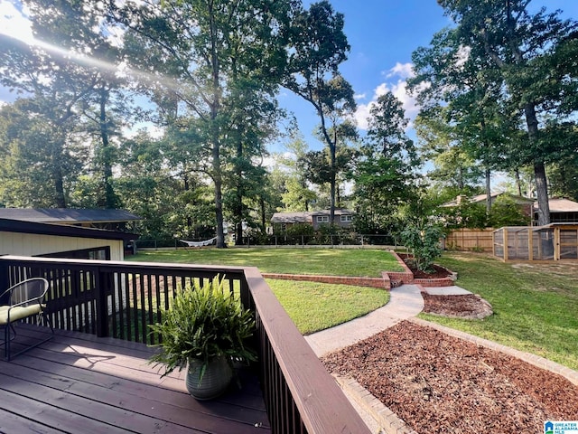 wooden terrace with a lawn