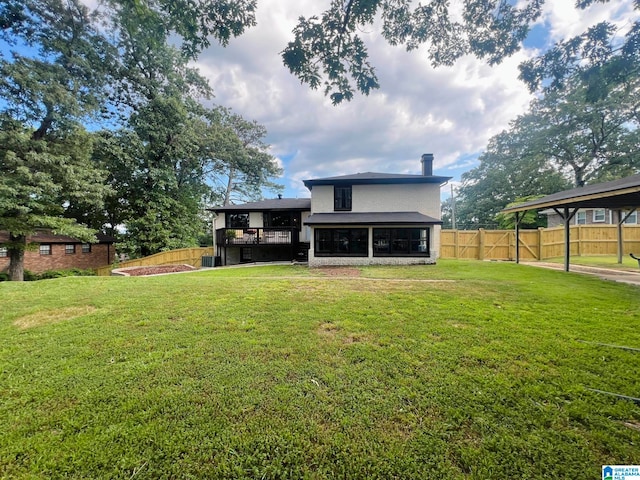 back of property with a lawn, central AC, and a sunroom