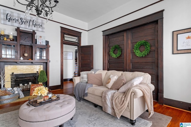 living room with wood-type flooring and a premium fireplace