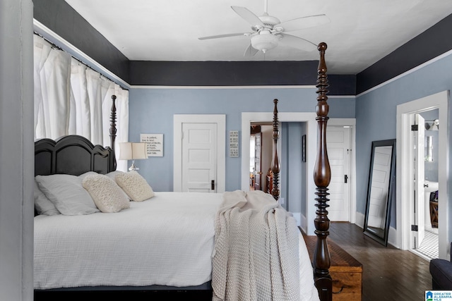 bedroom with dark hardwood / wood-style floors and ceiling fan