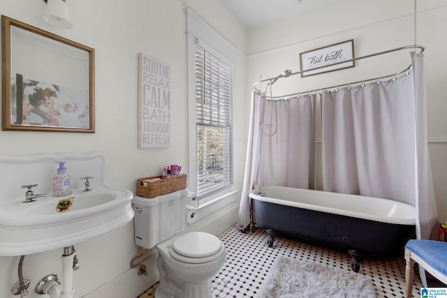 full bathroom with shower / bath combo, sink, and toilet