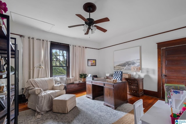 office featuring dark hardwood / wood-style floors and ceiling fan